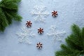 christmas blue background with fir twigs candies and snowflakes Royalty Free Stock Photo