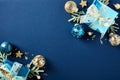 Christmas blue background with gift boxes and decorations in luxury style. Xmas greeting card template Royalty Free Stock Photo