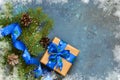 Christmas blue background with gift boxes and xmas tree. Royalty Free Stock Photo