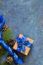 Christmas blue background with gift boxes and xmas tree. Royalty Free Stock Photo