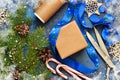 Christmas blue background with gift boxes and xmas tree. Royalty Free Stock Photo