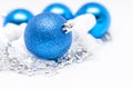 Christmas blue ball in focus and blue balls in background with Royalty Free Stock Photo