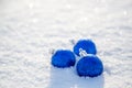 Christmas blue ball in the snow on a sunny day Royalty Free Stock Photo