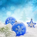 Christmas blue baubles on snow background Royalty Free Stock Photo