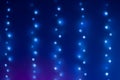 Christmas blue bokeh from garland in neon light. Bokeh lights. Beautiful Christmas background. Desfocused background Royalty Free Stock Photo