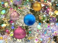 Christmas  blue gold lilac  ball on green tree and  colorful confetti illumination blurred light holiday background greetings card Royalty Free Stock Photo