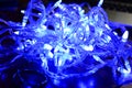 Christmas blue lights on black background for New Year celebration Royalty Free Stock Photo