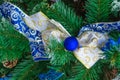 Christmas blue ribbon on green New Year tree branch