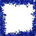 Christmas blue tinsel with stars as frame. Royalty Free Stock Photo