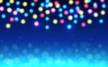 Christmas bokeh background. Color defocused lights on blue backdrop. Abstract shining circles. Unfocused soft glow Royalty Free Stock Photo