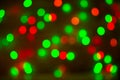 Christmas bokeh background, copy space. Defocused new year bokeh lights, free space. Blurred red and green bokeh. Royalty Free Stock Photo