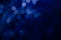 Abstract pattern of blue bokeh lights on a dark background Royalty Free Stock Photo