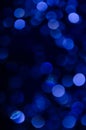 Abstract pattern of blue bokeh lights on a dark background Royalty Free Stock Photo