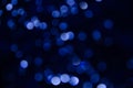 Abstract pattern of blue bokeh lights on a dark background Royalty Free Stock Photo