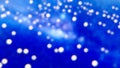 Abstract bokeh lights on blue background Royalty Free Stock Photo