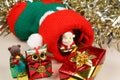 Christmas boot with Santa Claus figurine and gifts