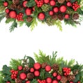 Christmas Border with Bauble Decorations and Winter Greenery Royalty Free Stock Photo