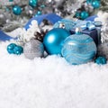 Christmas border with baubles, decorations and gifts on the snow Royalty Free Stock Photo