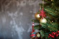 Christmas border branches of fir tree with decoration and grey concrete wall Royalty Free Stock Photo