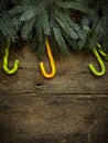 Christmas border with fir tree branches, pine cones and candy ca Royalty Free Stock Photo