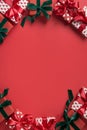 Christmas border of holiday gifts on red background. Boxing day. Greeting card. Happy New Year. Space for text Royalty Free Stock Photo