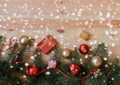Christmas border made of fir branches, decorations and gifts. Royalty Free Stock Photo