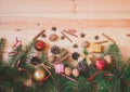 Christmas border made of fir branches, christmas decorations, spices, walnuts and gifts. Royalty Free Stock Photo