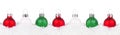 Christmas border of red, green and white ornaments in snow isolated on white Royalty Free Stock Photo