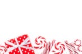 Christmas border of red and white gifts and candies