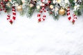 Christmas Border - tree branches with golden baubles, candies and cones on snow Royalty Free Stock Photo