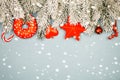 Christmas border. Winter background with snow and red Xmas decorations Royalty Free Stock Photo