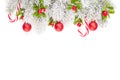 Christmas border. Winter Xmas tree branch, red holly berries and glass balls. New Year decoration isolated on white Royalty Free Stock Photo