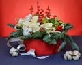 Christmas bouquet of roses and fir branches in a red box Royalty Free Stock Photo