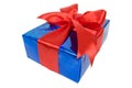 Christmas box in blue film wrap with red ribbon