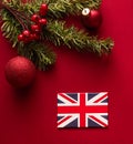 Christmas, boxing day and United Kingdom flag, traditional holiday gifts, presents on red background flat lay, wrapped Royalty Free Stock Photo