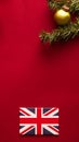 Christmas, boxing day and United Kingdom flag, traditional holiday gifts, presents on red background flat lay, wrapped Royalty Free Stock Photo