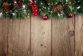 Christmas branch top border on rustic old wood