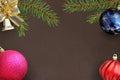 Christmas branches of spruce, blue, pink and red wavy balloon, decorative bell on dark Royalty Free Stock Photo