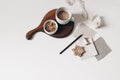 Christmas breakfast still life. Beige fabric linene swatches isolated on white. background. Gingerbread cookies and cup Royalty Free Stock Photo