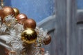 Christmas brown golden balls and white garland decorations on door`s background