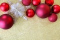 Christmas Bulbs and Star Tree Topper Framing Gold Glitter Background Royalty Free Stock Photo