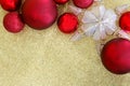 Christmas Bulbs and Star Tree Topper Framing Gold Glitter Background Royalty Free Stock Photo