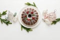 Christmas bundt cake with Xmas holiday decorations, top down view