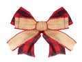 Christmas burlap bow with red and black buffalo plaid check ribbon underneath isolated on white Royalty Free Stock Photo