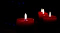 Christmas burning candles on the blue bokeh background. The concept of a family holiday,