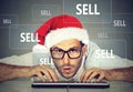 Christmas business man in santa hat selling stuff on internet Royalty Free Stock Photo