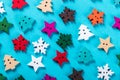 Christmas buttons carved out of wood on a blue background Royalty Free Stock Photo