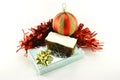Christmas Cake with Gift, Bauble and Tinsel Royalty Free Stock Photo