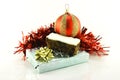 Christmas Cake with Gift, Bauble and Tinsel Royalty Free Stock Photo