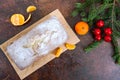 Christmas cake with nuts, dried fruit, tangerines.